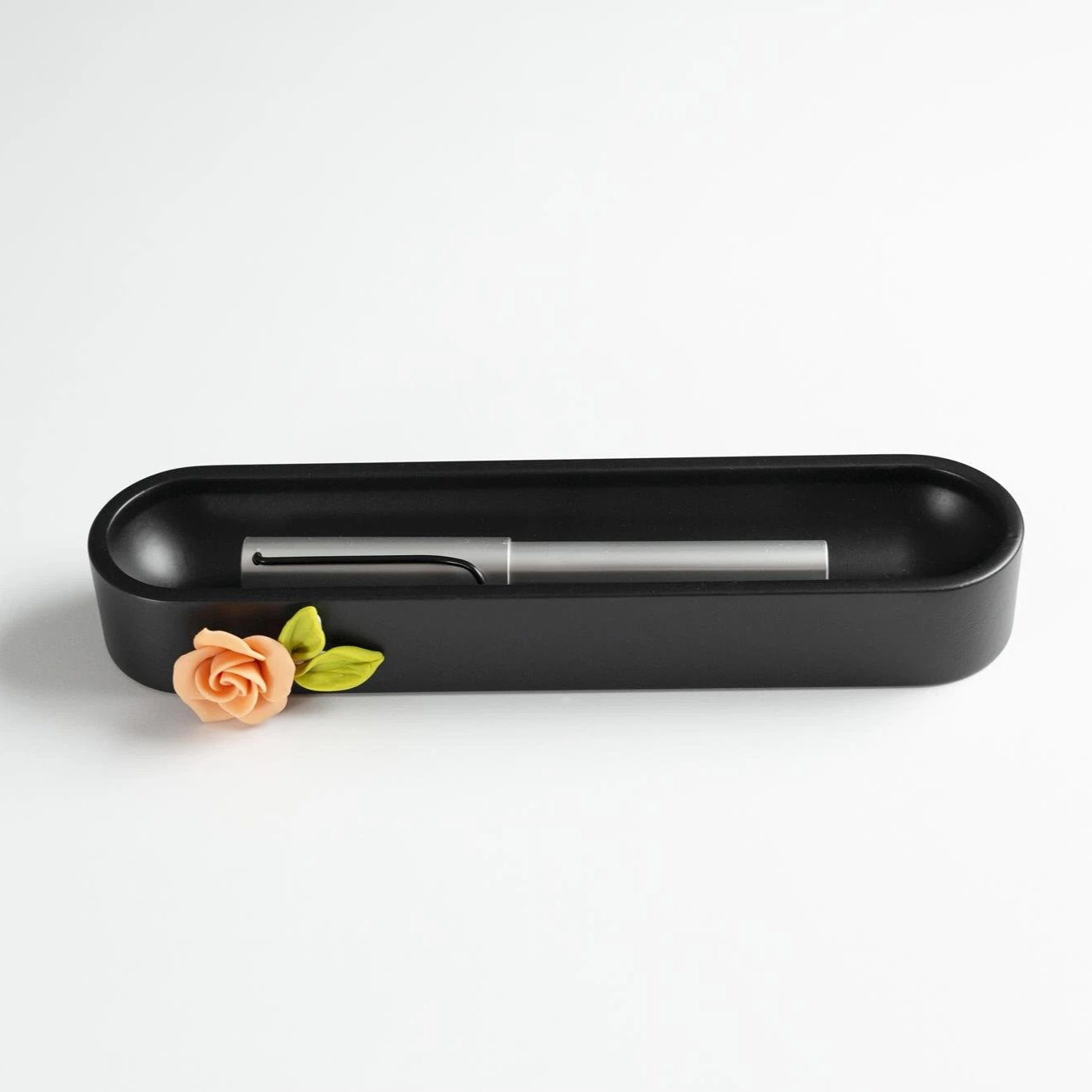 Black Oval Pen Tray with a Flower
